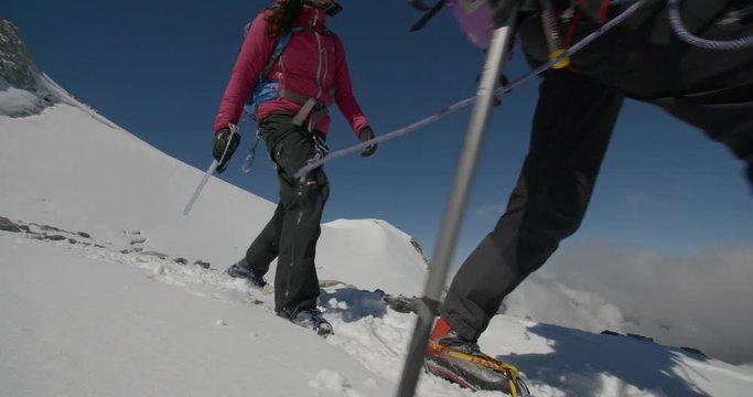Two Mountaineers Roped Together Walking Slow Motion High Altitude