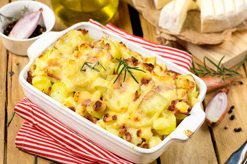 French dish Tartiflette with potatoes, reblochon cheese and baco