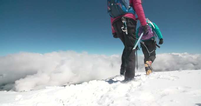 Mountaineers Crossing Glacier Above the Clouds 