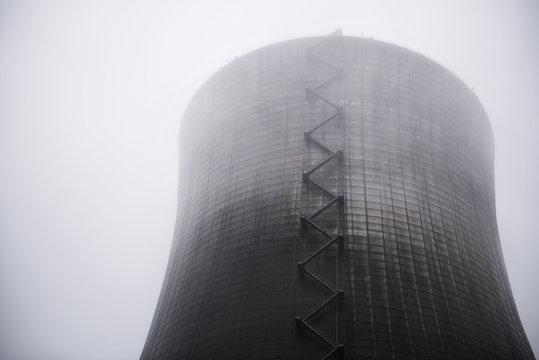 Low angle view of nuclear reactor in foggy weather