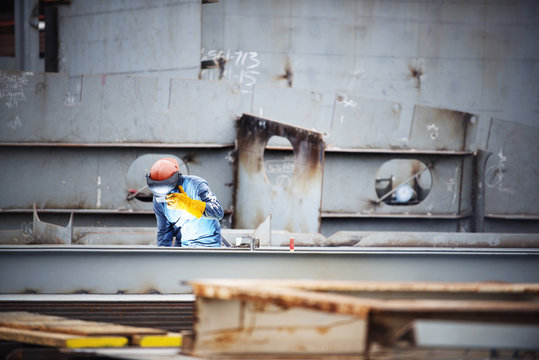 Worker working at shipyard