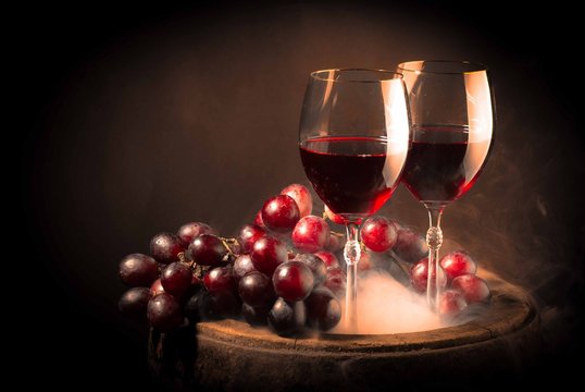 Red Wine Glass On Wooden Barrel Isolated On Black Gradient