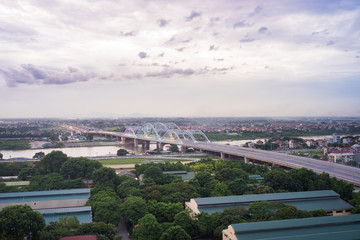 Aerial view of Dong Tru bridge crossing Red River at twilight in Hanoi, Vietnam