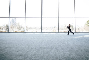 Girl running in empty room