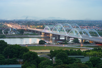 Aerial view of Dong Tru bridge crossing Red River at twilight in Hanoi, Vietnam