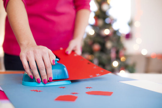 Young woman make scrapbook of the papers on the table using anti