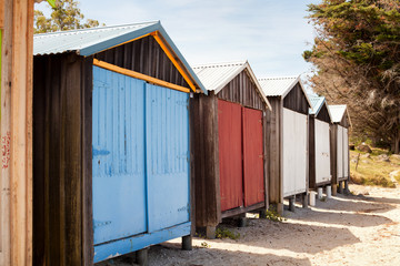 Naklejka premium Boat sheds on the beach