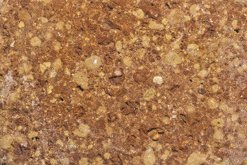 closed detail of a old mud brick with stones