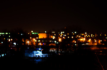 Fototapeta na wymiar Blurred background of the car lights