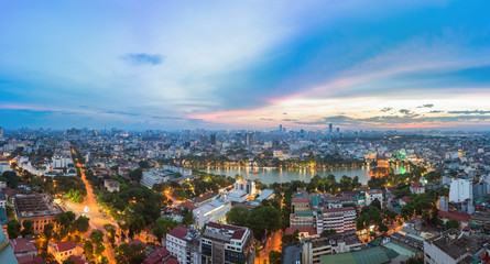 Aerial skyline view of Hoan Kiem lake (Ho Guom, Sword lake) area at twilight. Hoan Kiem is center of Hanoi city. Hanoi cityscape.