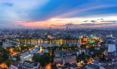 Aerial skyline view of Hoan Kiem lake (Ho Guom, Sword lake) area at twilight. Hoan Kiem is center of Hanoi city. Hanoi cityscape.