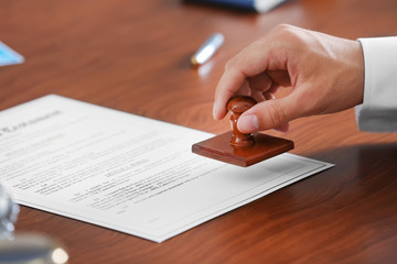 Notary public in office stamping document