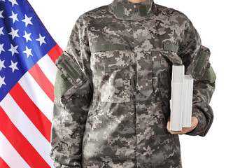 Soldier holding books. Military education concept