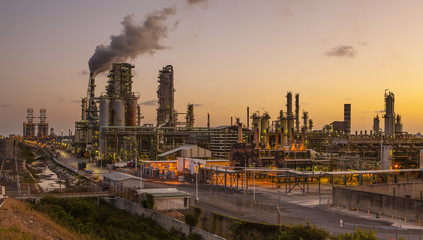 Smoke emitting from chimney at factory during dusk