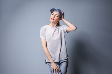 Beautiful young woman on color background