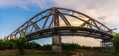 Side panorama view of Long Bien ancient metal bridge at early morning in Hanoi, Vietnam