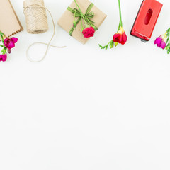 Pattern with red flowers, packet and gift box isolated on white background. Flat lay, Top view.