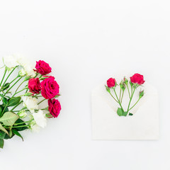 Beautiful red roses on white background. Flat lay, Top view.