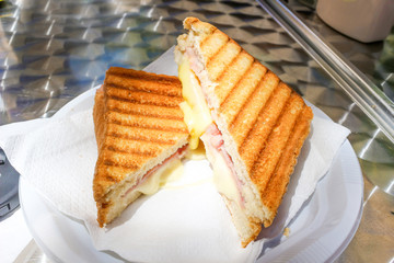 Ham and Cheese French Grilled Toasts on white background / sandwich ham cheese on a plate.