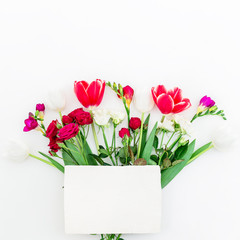 Bouquet with flowers and paper card isolated on white background. Flat lay,
