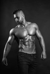Fototapeta na wymiar Handsome, muscular and sexy young bodybuilder man