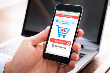 Person Shopping Online On Mobile Phone