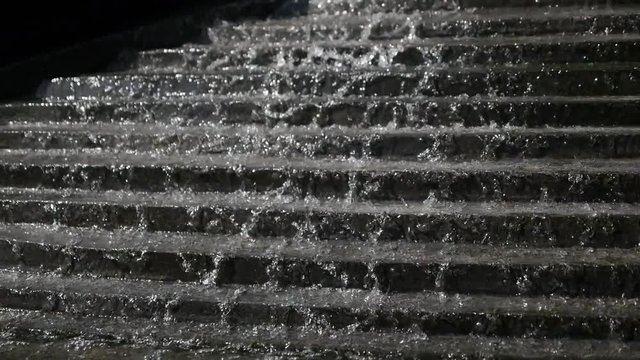 Clean Water Running from Stairs in Fountain