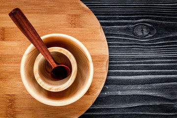 wooden kitchen utensils on dark background top view