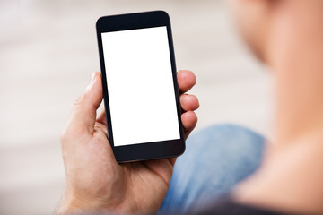 Man's Hand Holding Cell Phone With Blank Screen