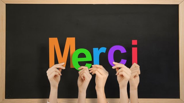Hands holding up merci
