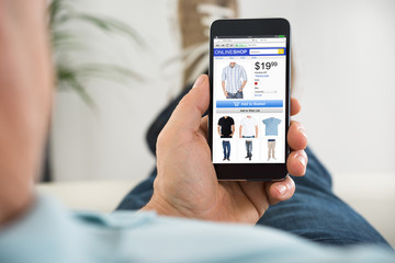 Close-up Of Man Shopping Online On Smartphone