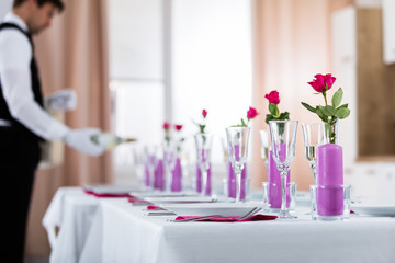 Waiter Pouring Champagne Into Glass