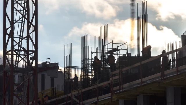 Time lapse video of steeplejack workers on construction activities
