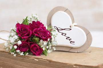 Roses and wooden heart