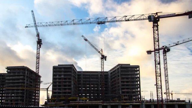 Cranes working on construction of the housing estate in former industrial zone time lapse
