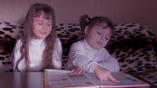 Children reading the book. Full HD