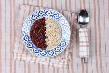 Obraz na płótnie Canvas Ready served of brown rice and organic red jasmine rice.
