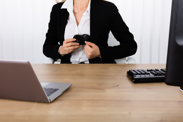 Businesswoman Hiding Mouse In Her Blazer