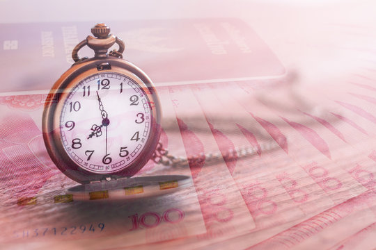 pocket watch over yuan banknotes with double exposure effect, ti