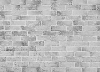 Fototapeta premium Closeup surface brick pattern at old stone brick wall texture background in black and white tone