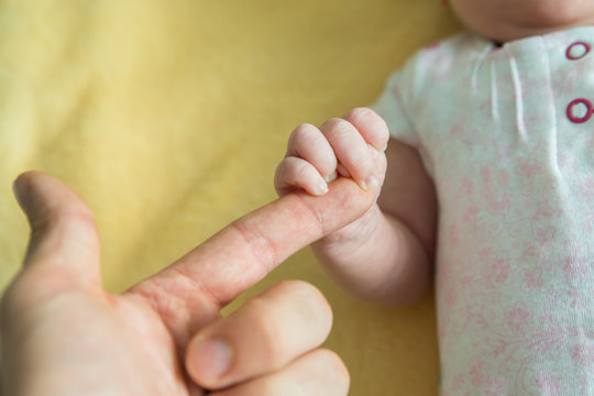 Baby Holding Parent's Finger