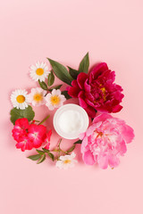 cosmetic creams with pink flowers