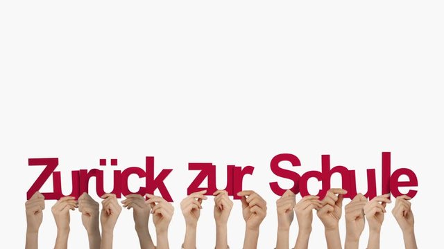 Hands holding up zuruck zur schule