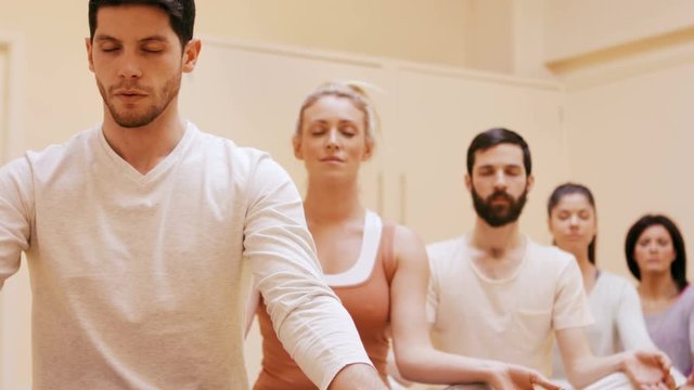 Group of people doing meditation