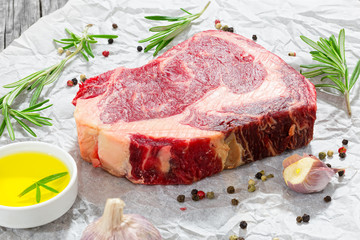 raw beef rib eye fresh meat steak on white paper