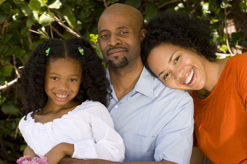 Loving African American parents and their daughter.