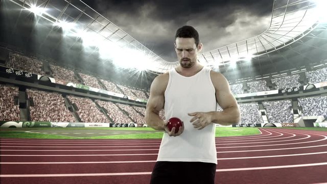 Male athlete preparing to throw shot put ball