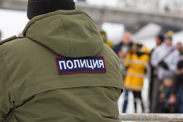 Russian police - emblem on the back OMON during Christ's baptism holiday
