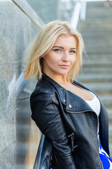 Obraz premium Portrait of a beautiful blonde in blue skirt