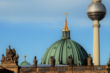 Berlin landmarks / View from the boulevard Unter den Linden to cathedral dome and tv tower globe